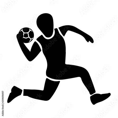 Handball player dribbling a ball in action