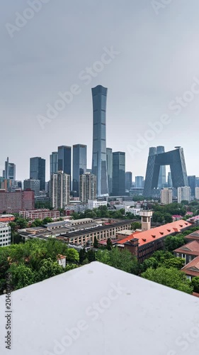 Old buildings and supertall skyscrapers of Beijing's cityscape are framed together.