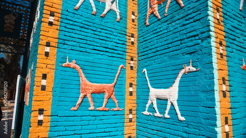 Photos Discover colorful murals of dogs in Babylon Iraq showcasing ancient art style
