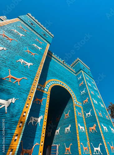 Ancient Ishtar Gate stands proudly in Babylon, Iraq showcasing vibrant animal reliefs