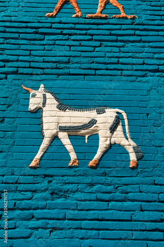 Colorful bull relief in Babylon showcasing ancient Mesopotamian art techniques