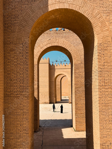 Exploring ancient architecture in Babylon Iraq under a clear blue sky