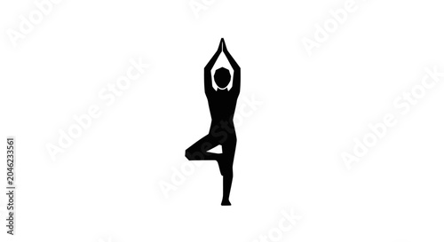 Woman in yoga tree pose standing.