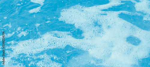 Tableau sur toile Abstract texture of turbulent blue water surface with white sea foam bubbles cre