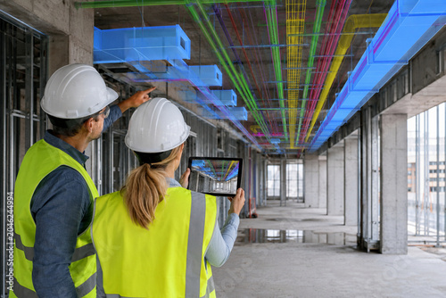 Engineers Using Augmented Reality MEP Ceiling Overlay with Tablet at Construction Site generative ai