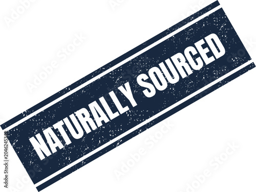 Fotografie Dark blue ink stamp with the words naturally sourced printed in a clean vintage