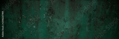 Slika na platnu Weathered dark green painted metal surface perfect for backgrounds, textures, industrial design projects, website backgrounds, and graphic design materials