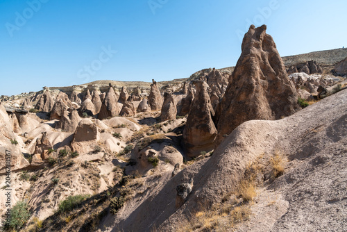 Geological formations formed by erosion in the Devrent Valley in Cappadocia on a summer day.