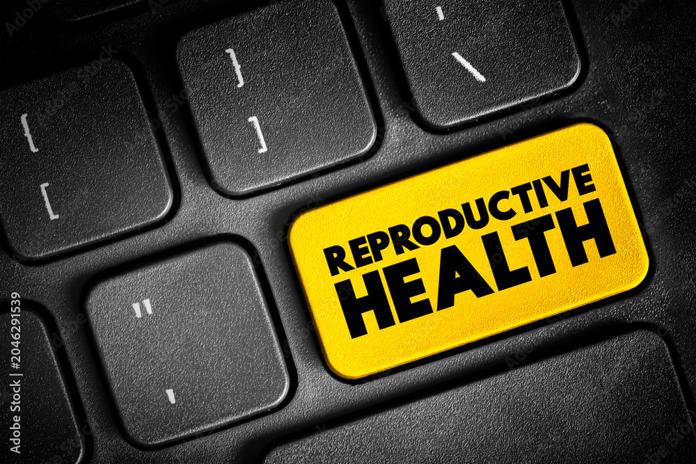 Fototapeta premium Reproductive Health - condition of male and female reproductive systems during all life stages, text button on keyboard, concept background