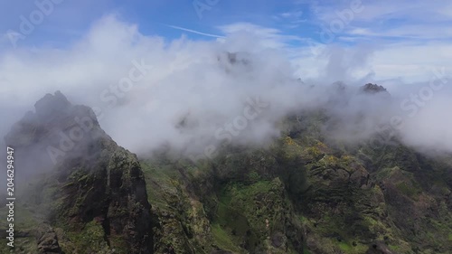 Time-lapse of clouds flying over mountain peaks on PR1 trail in Madeira