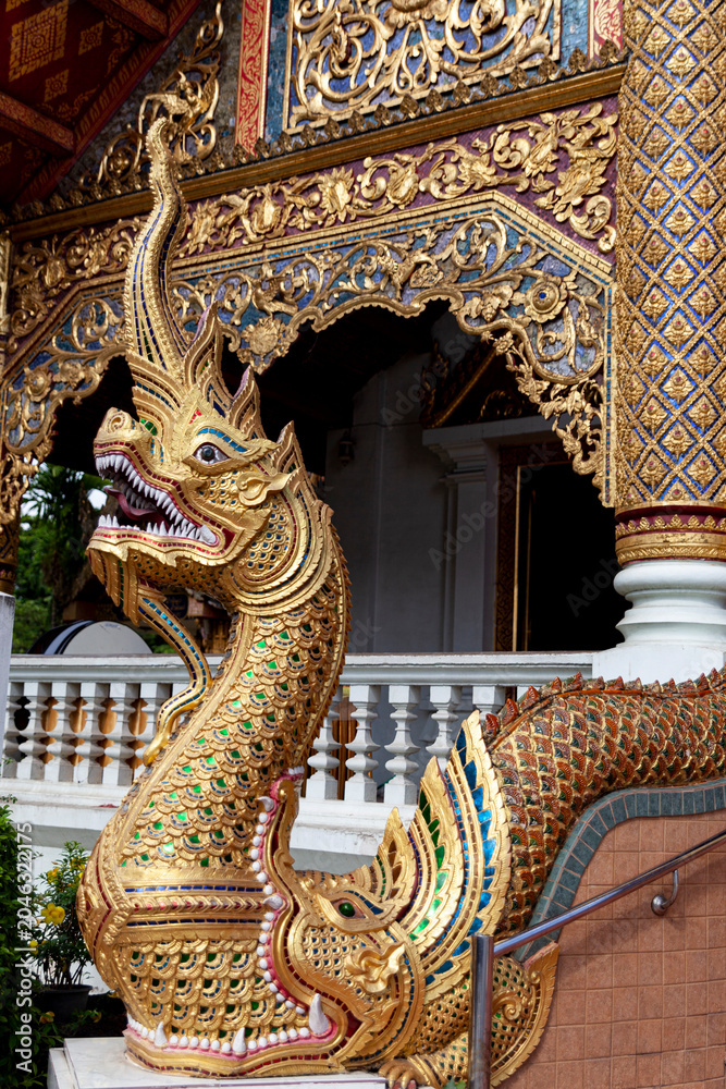 Fototapeta premium Colorful naga serpent sculpture at Thai Buddhist temple entrance