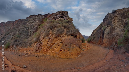 Northern Kyrgyzstan. Picturesque winding trails of the Kok Moinok canyons with red-brown rock along the Chu River.