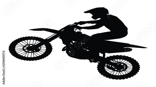 Photos Motocross rider performs an aerial jump while riding a dirt bike across the track
