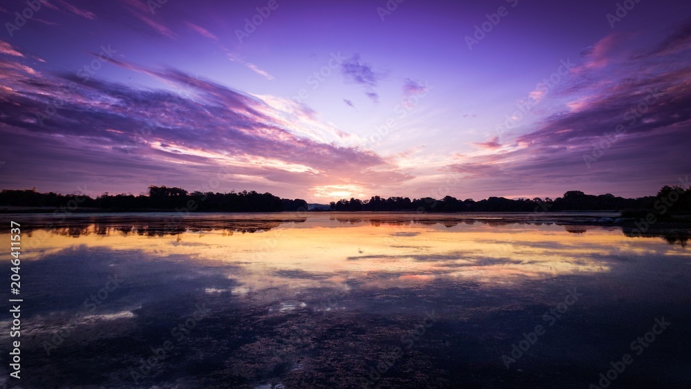 Obraz premium sunset over the river