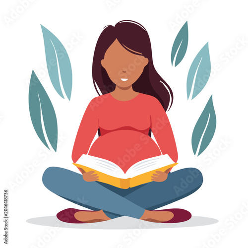 Pregnant woman sitting cross-legged reading a book