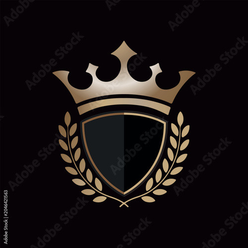 Luxury Golden Crown and Shield Logo Design.Royal Heraldic Emblem with Laurel Wreath on Black Background