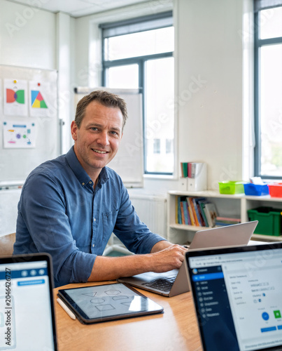 Male Teacher Developing Digital Curriculum and Learning Materials