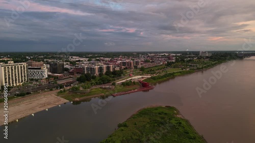 Aerial view of city waterfront and river at dusk