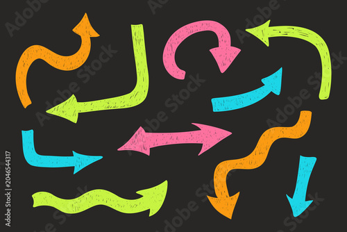 Hand drawn scribble arrows collection with rough sketch texture. Curved, wavy and directional doodle arrows in retro style for notes, stickers, social media.