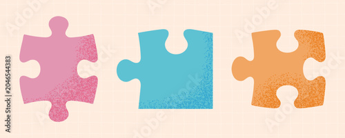 Set of three jigsaw puzzle pieces with a grainy texture. Perfect for teamwork concepts.