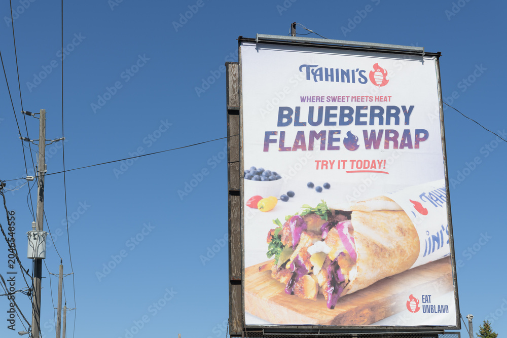 Obraz premium roadside billboard for Tahini's Shawarma, a Middle Eastern restaurant chain (2151 St Clair Av W), Toronto