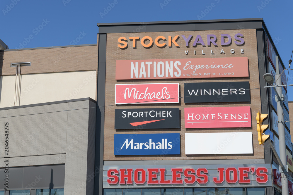 Naklejka premium wall with business signs at Stock Yards Village located at 1980 St Clair Av W, Toronto