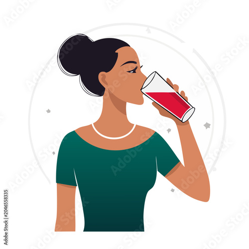 Woman drinking a red beverage from a glass