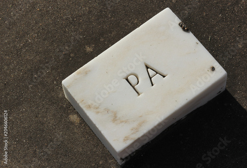 Marble Brick Stone in Cemetery With Word Pa Engraved
