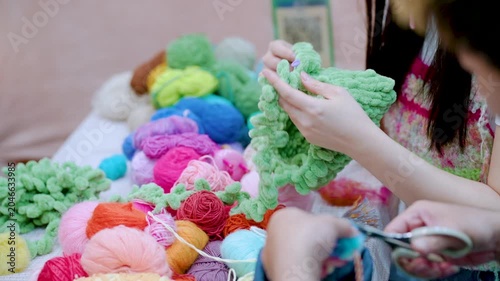 Colorful yarn and pom pom crafts at handmade workshop