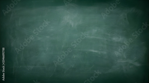 green empty school chalkboard background with erased chalk residue texture