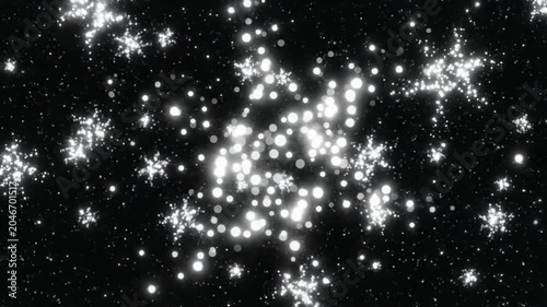 Abstract white sparkling light clusters on black background