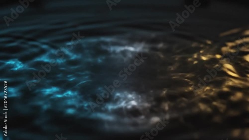 Glowing blue water ripple on dark surface macro photography