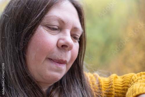 Tableau sur toile upset mature woman looking sad and resentful outdoors, middle aged female experi