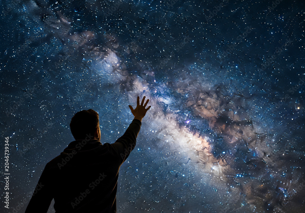 Obraz premium 夜空に手を伸ばす人 | A person reaching out to the night sky Generative AI
