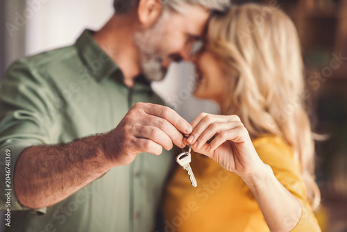 Photos Happy Senior Caucasian Smiling And Holding Keys Together At Home, Celebrating Ne