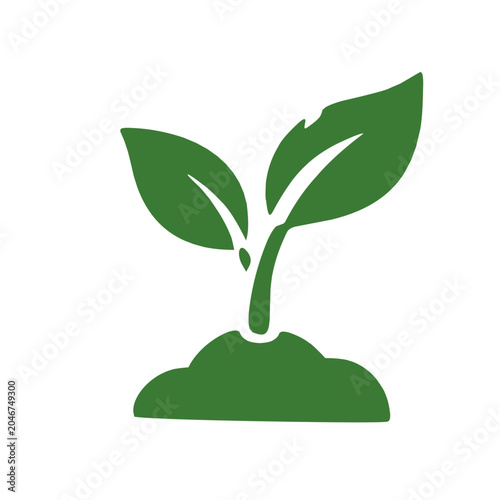 Young green plant sprouting from soil symbolizing new growth and nature.