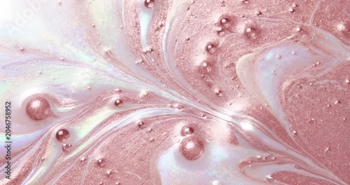 Abstract pink liquid swirl with bubbles, macro cosmetic texture background
