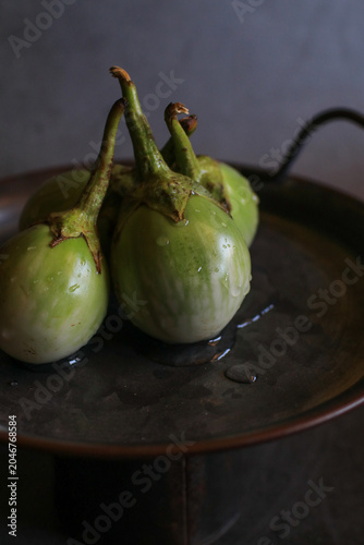 Thai eggplant on black background, representing healthy organic vegetable food from the garden. 