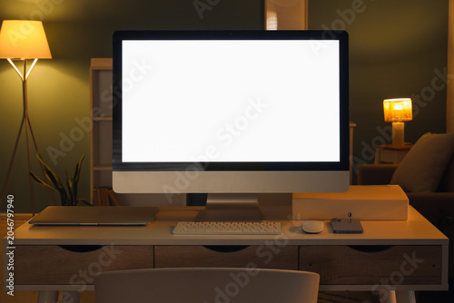 Workplace with blank comput...