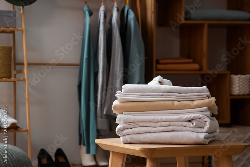 Stack of bed sheets on tabl...