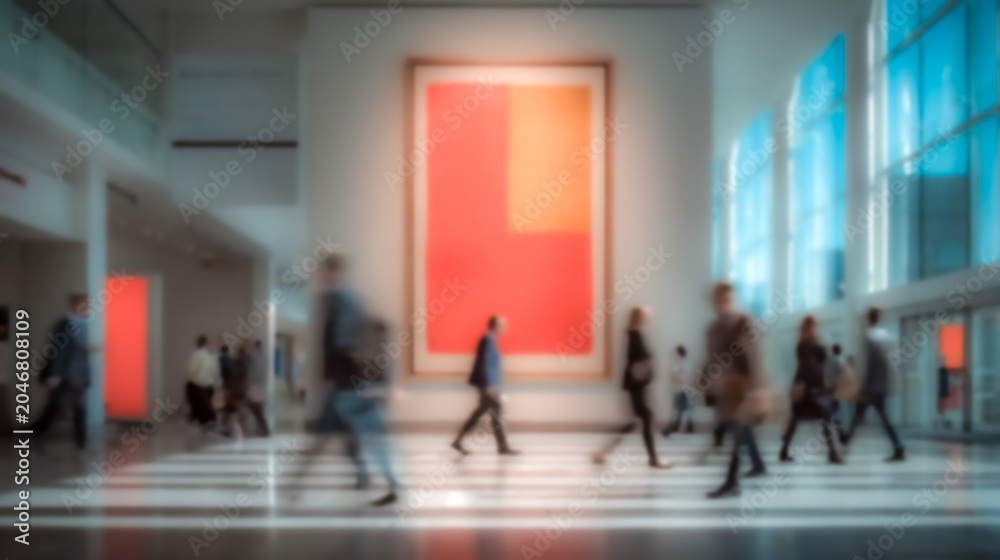 Fototapeta premium An abstract blur bustling expo environment appears with business people in motion across a bright hall enhanced by a smooth bokeh effect.