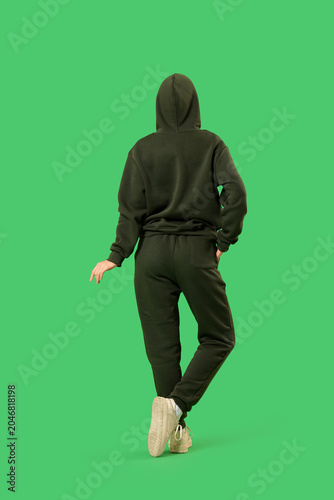 Young woman in sports suit ...
