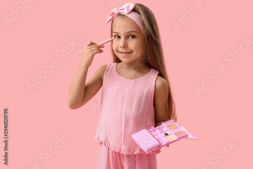 Cute little girl with cosme...
