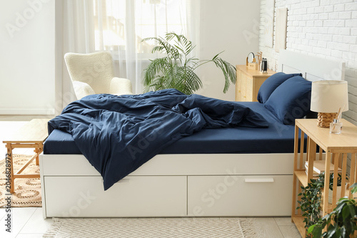 Interior of light bedroom w...