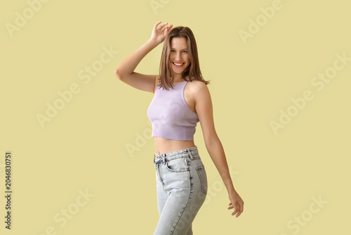Happy young woman dancing o...