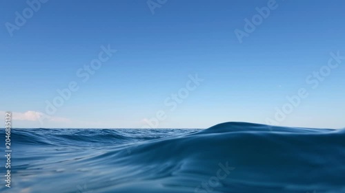 Swimming perspective of blue ocean waves in summer