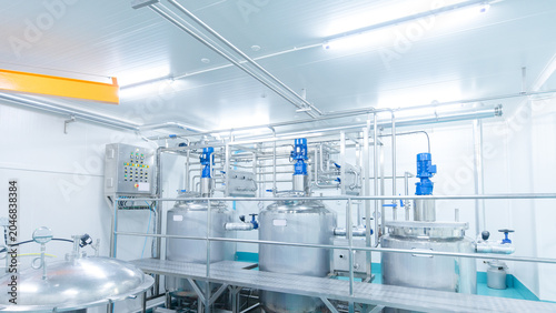 Cuadro en lienzo Modern stainless steel processing tanks automated mixing system inside hygienic food manufacturing facility industrial production equipment safe quality control efficient large scale operations