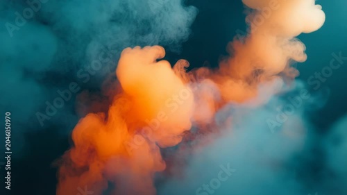 Abstract image featuring vibrant orange smoke against a teal and dark blue backdrop, ethereal and artistic