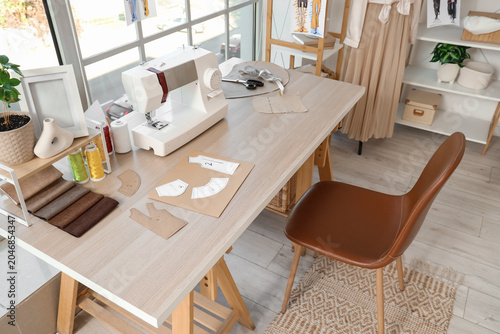Tailor's workplace with sew...
