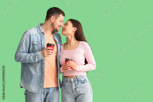 Young couple kissing and ho...